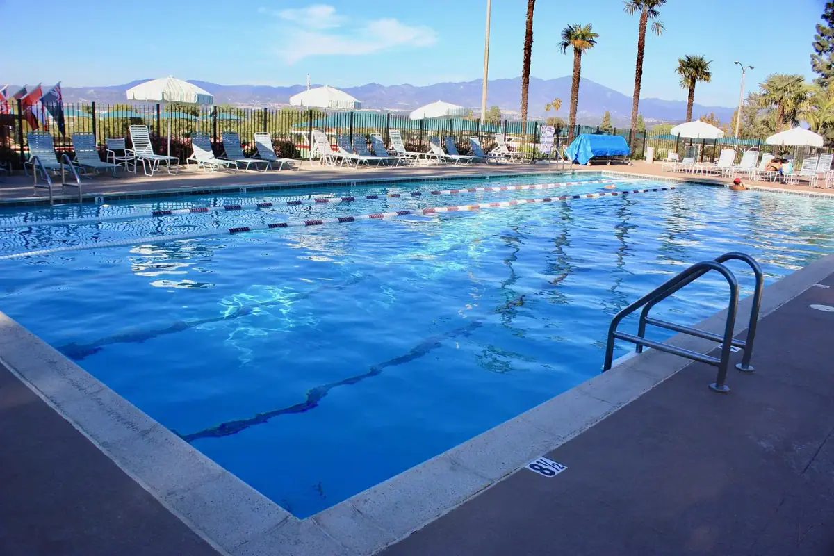 Laguna Woods Village clubhouse pool and palms in Laguna Woods, CA